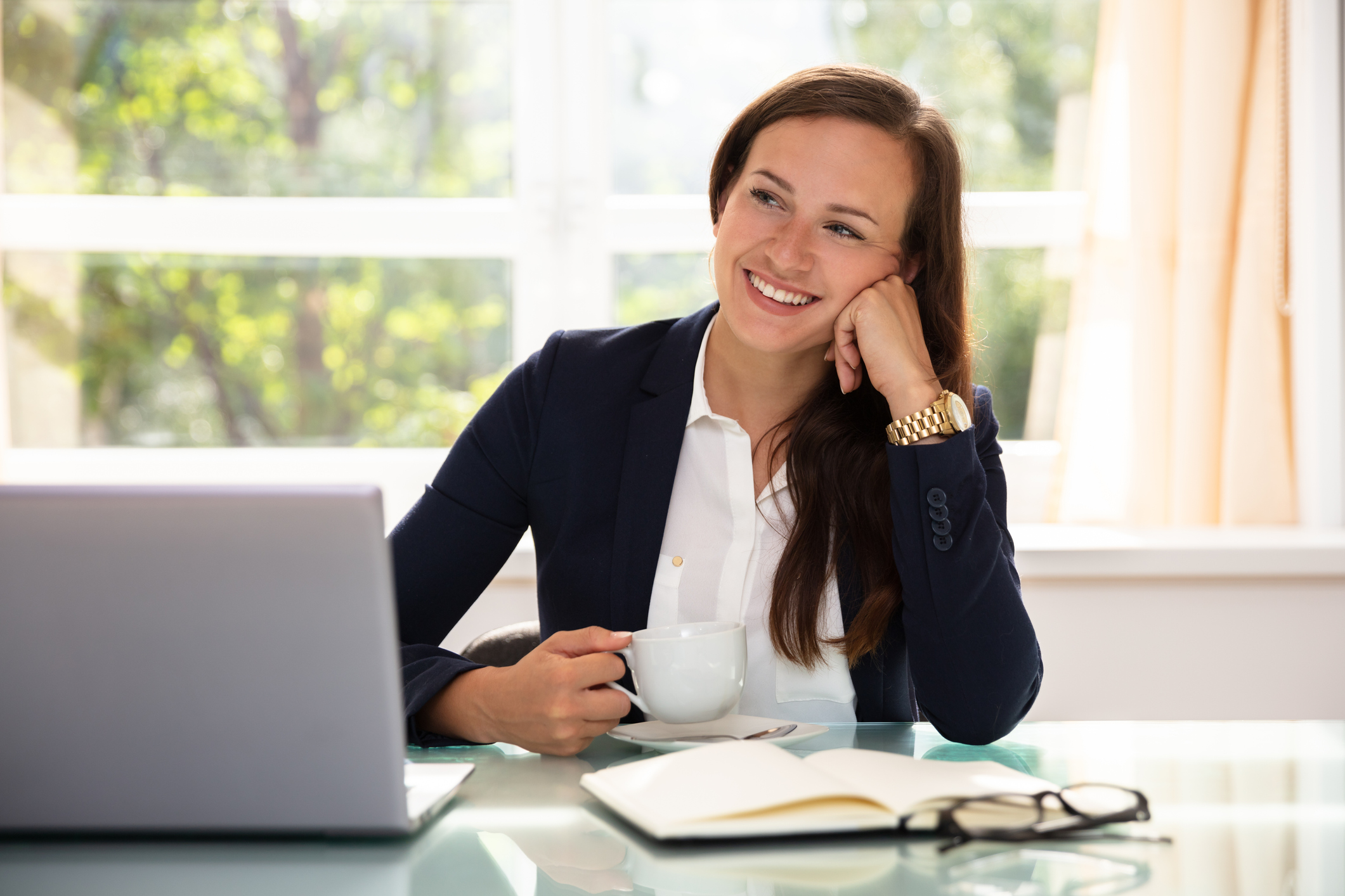 Contemplated Happy Businesswoman With Cup Of Coffee